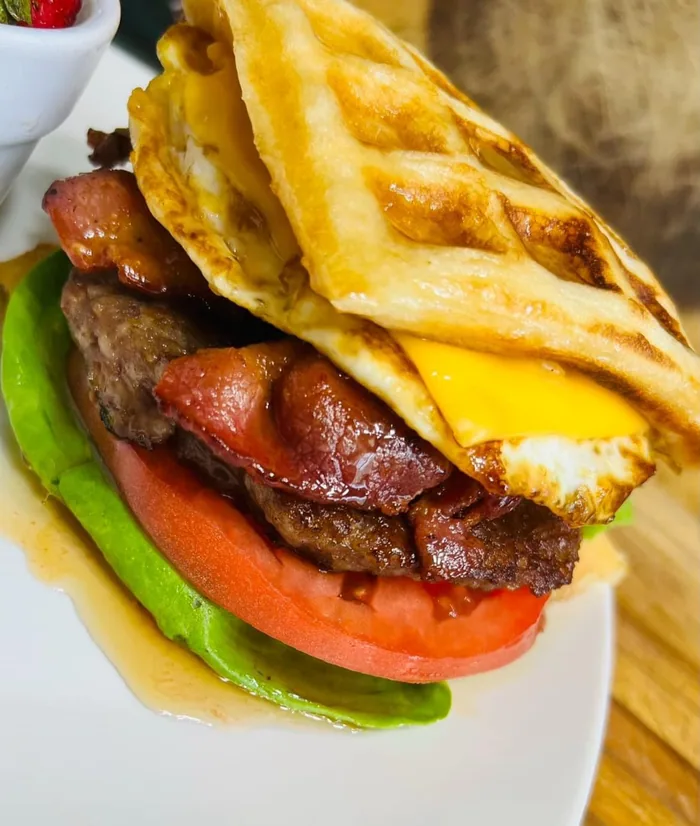 Sausage, egg and cheese served in a folded waffle