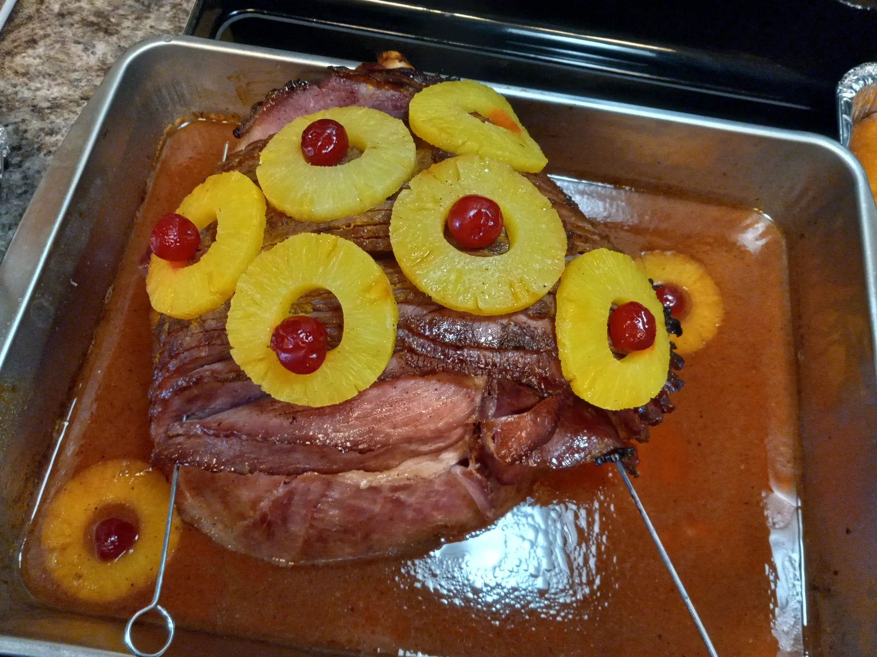 Glazed ham with pineapple prepared by Minnie's for a catered gathering