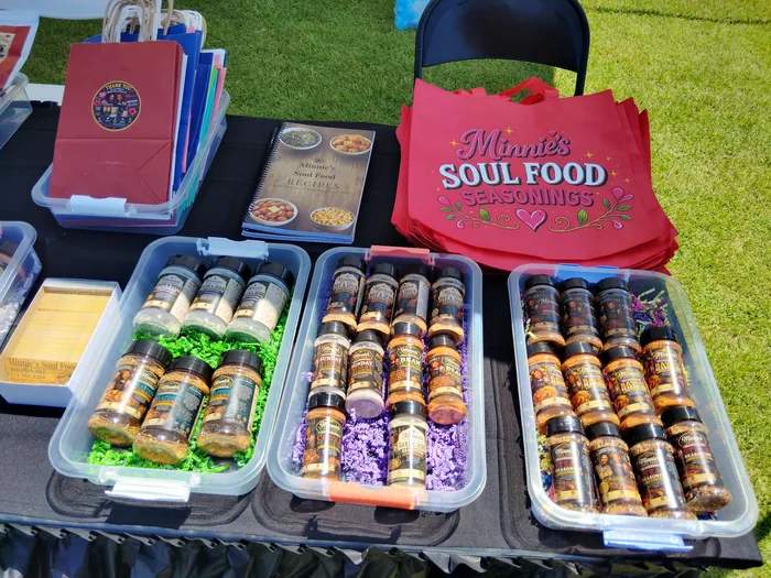 A close view of seasoning bottles and fry coating boxes on the display table
